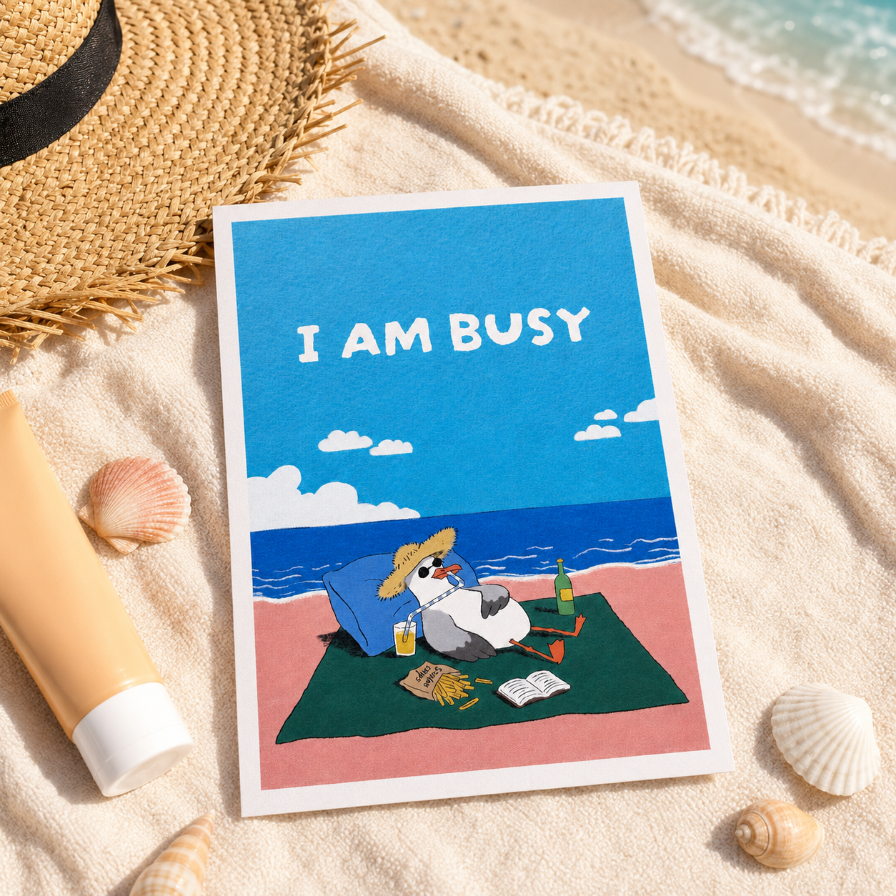 +61 Studios beach towel display of I AM BUSY seagull postcard