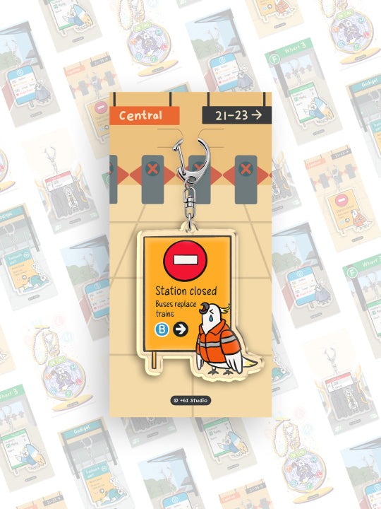9to5 Studios train station platform backing card keychain with silver clasp