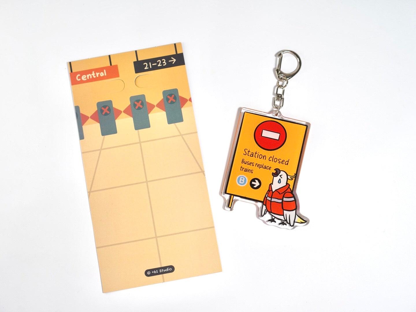 +61 Studio Train Station Closed keychain with teary-eyed cockatoo design, acrylic double-sided print, metal clasp