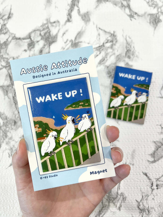 9to5 Studios +61 Studio WAKE UP! cockatoo fridge magnet in packaging, white birds with yellow crests on coastal scene