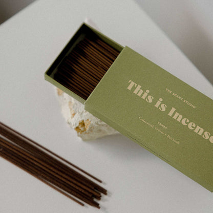 Gentle Habits This Is Incense YAMBA sticks with cedarwood scent burning in holder