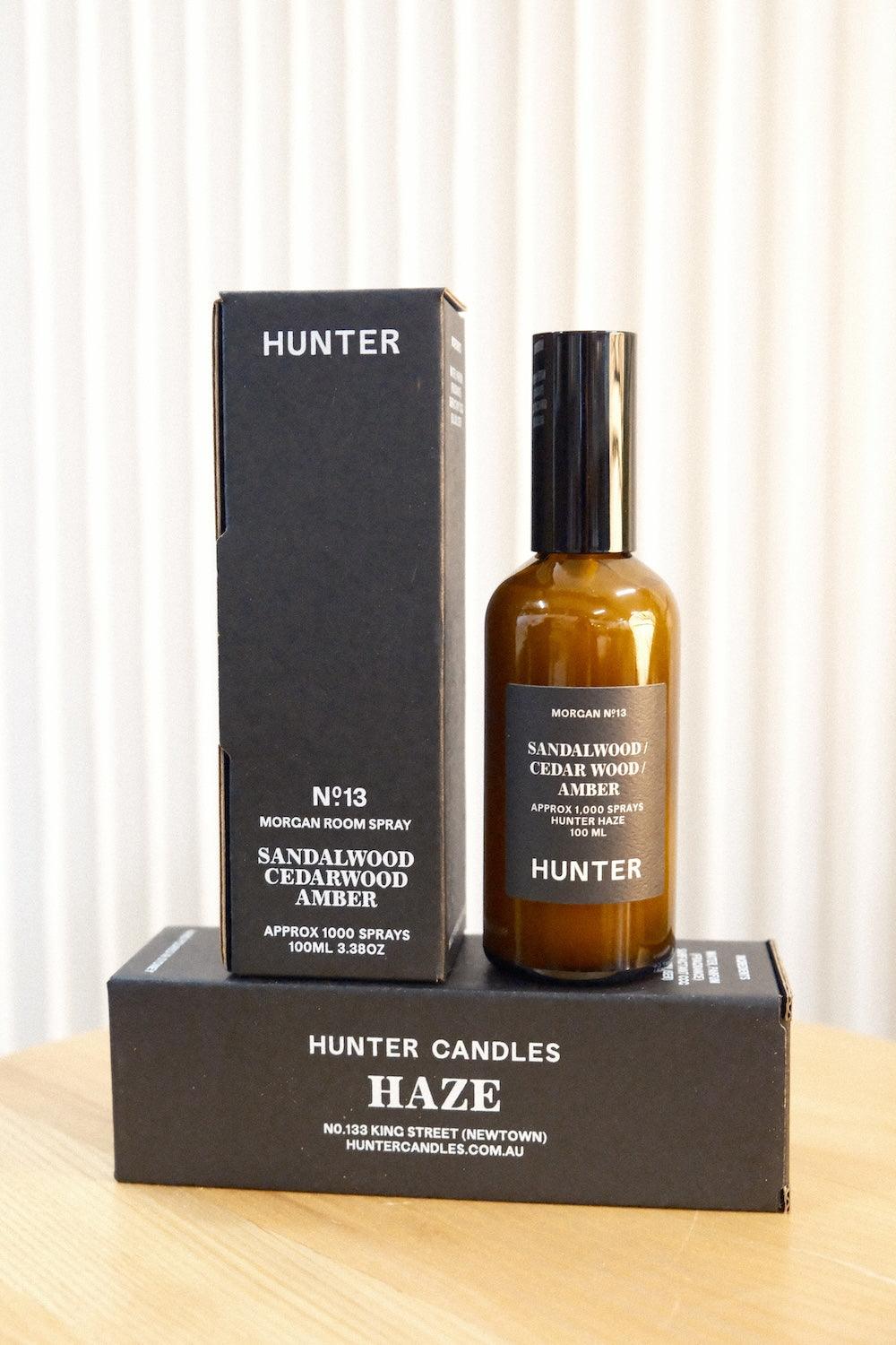 Hunter Candles The Haze room spray bottle and upright box resting on flat branded packaging