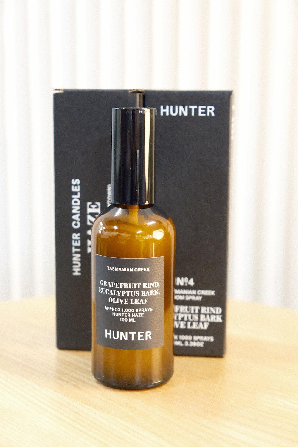 Close-up of Hunter Candles Haze label showing grapefruit rind, eucalyptus bark, and olive leaf notes