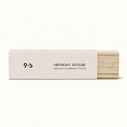 Single off-white Midnight Reverie incense box with sliding natural wood tray and embossed seal on plain background