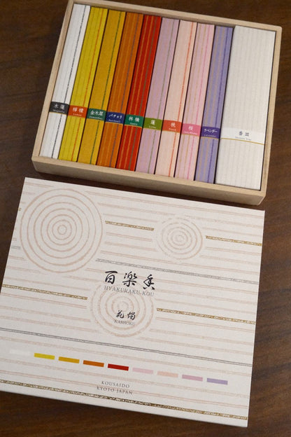 Kousaido Hyakurakko Gift Set with 9 premium incense fragrances and milky-white plate