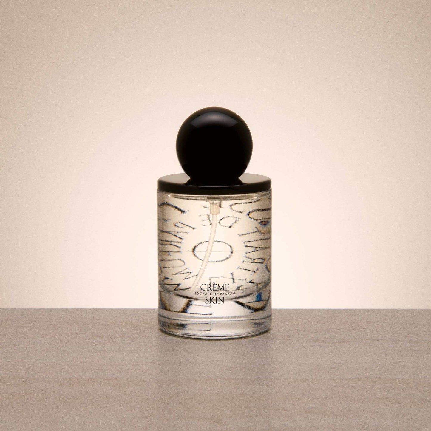 9to5 Studios Odesse Crème Skin minimalist glass perfume bottle with black cap