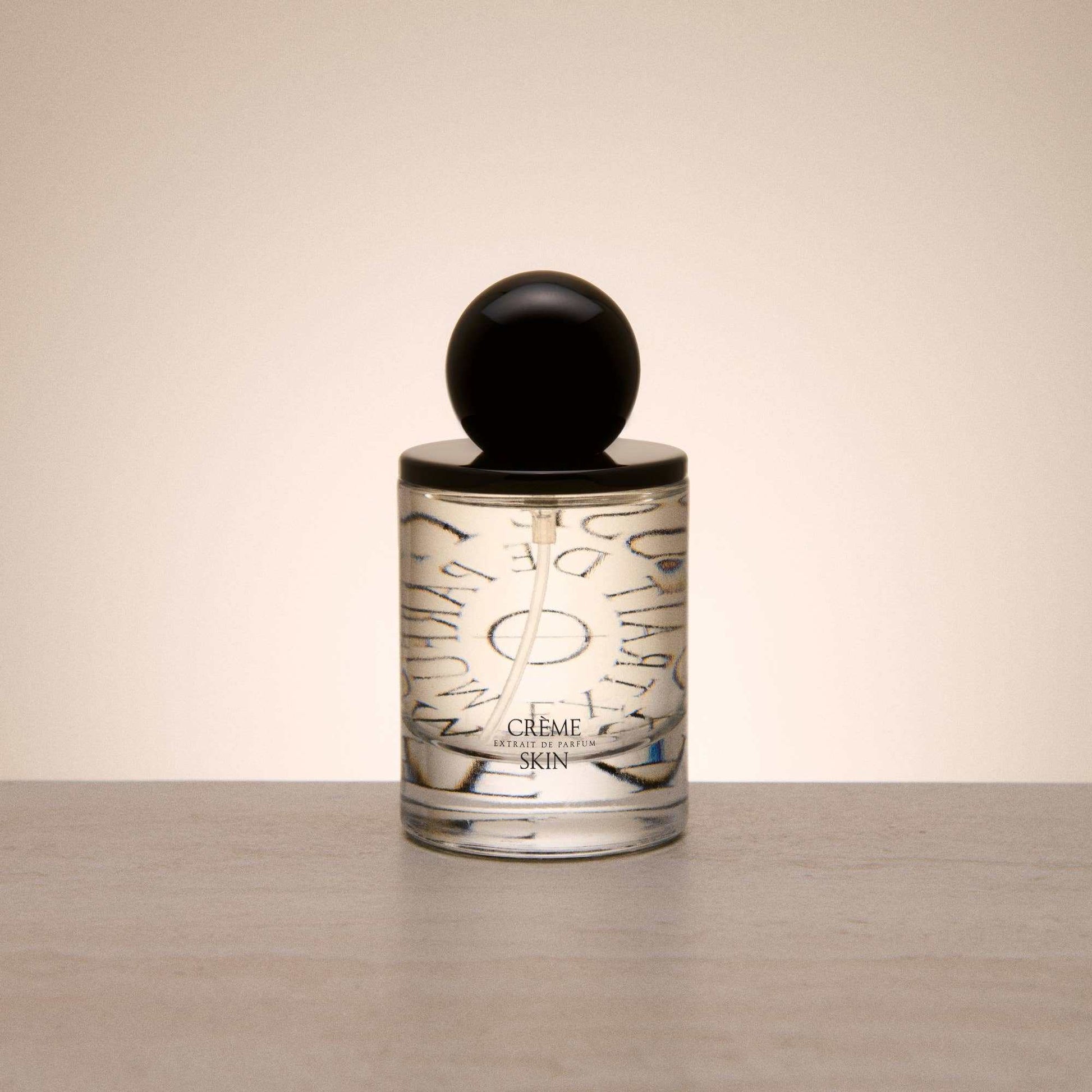 9to5 Studios Odesse Crème Skin minimalist glass perfume bottle with black cap