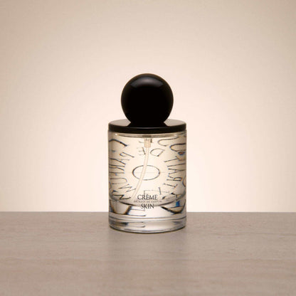 9to5 Studios Odesse Crème Skin minimalist glass perfume bottle with black cap