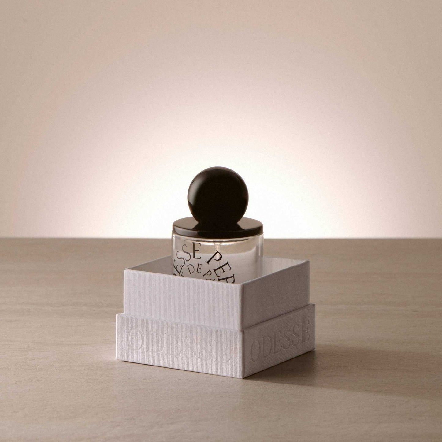 9to5 Studios Odesse Crème Skin perfume emerging from textured white box
