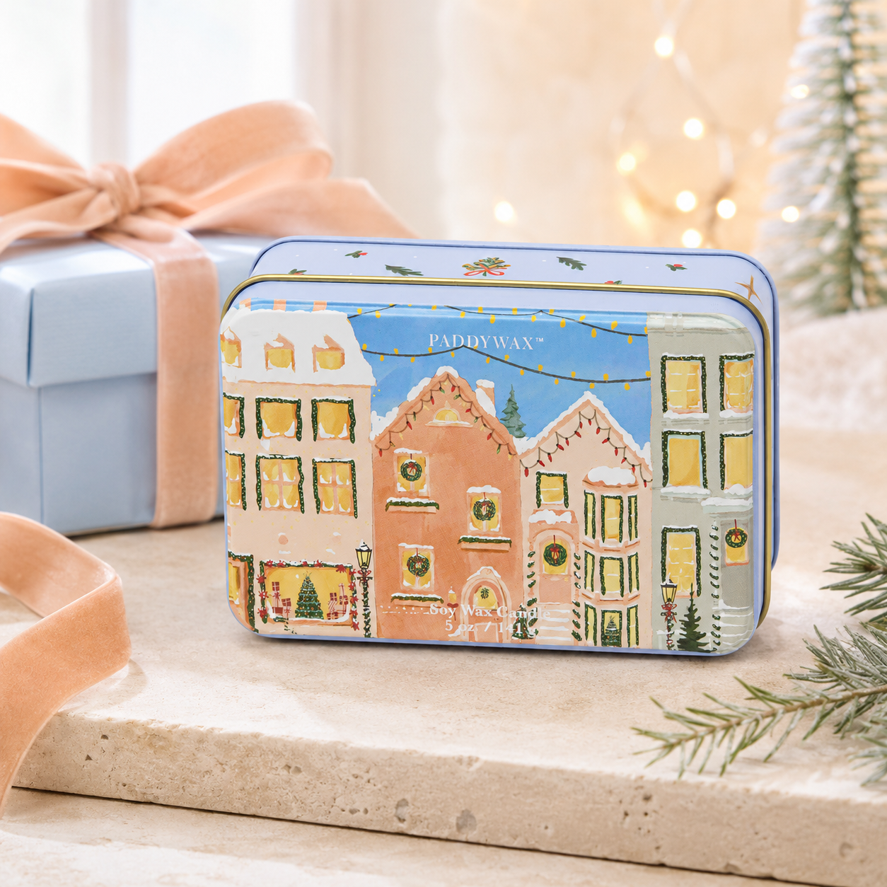 9to5 Studios Paddywax Matte Printed Christmas Village Soy Wax Candle in peach and grey illustrated tin with velvet ribbon