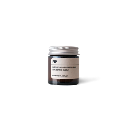 Amber glass Posie Candle with watermelon, cucumber, and basil scent in aluminium lid jar