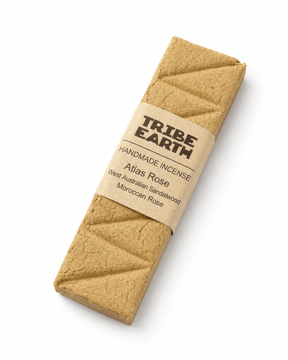 Tribe Earth ROSES Handmade Sandalwood and Moroccan Roses incense plank burning in a dish