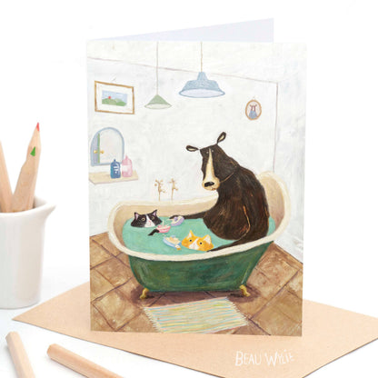 Bath Time greeting card by Beau Wylie for 9to5 Studios featuring bear and cats in teal tub on recycled white cardstock