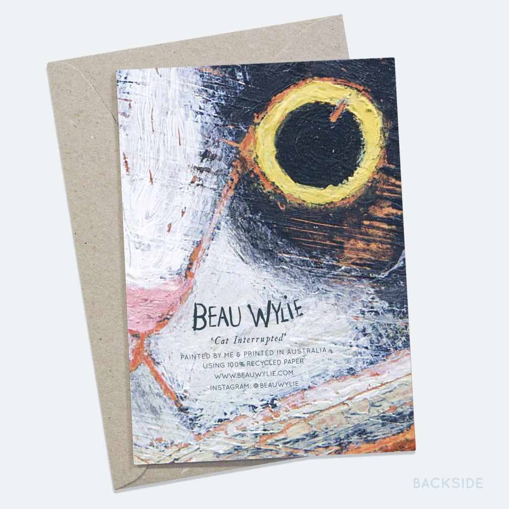 Back of Cat Interrupted A6 greeting card showing artist signature and recycled paper details by Beau Wylie at 9to5 Studios