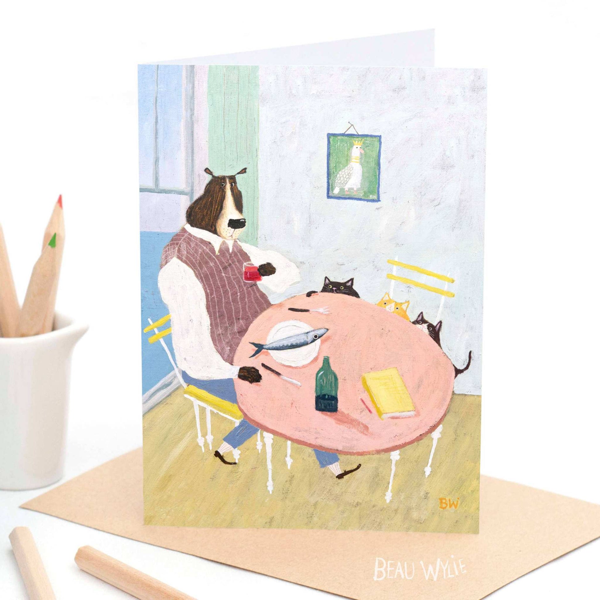 Dinner Guests greeting card by Beau Wylie from 9to5 Studios featuring quirky dog and cats at dinner table on recycled white cardstock