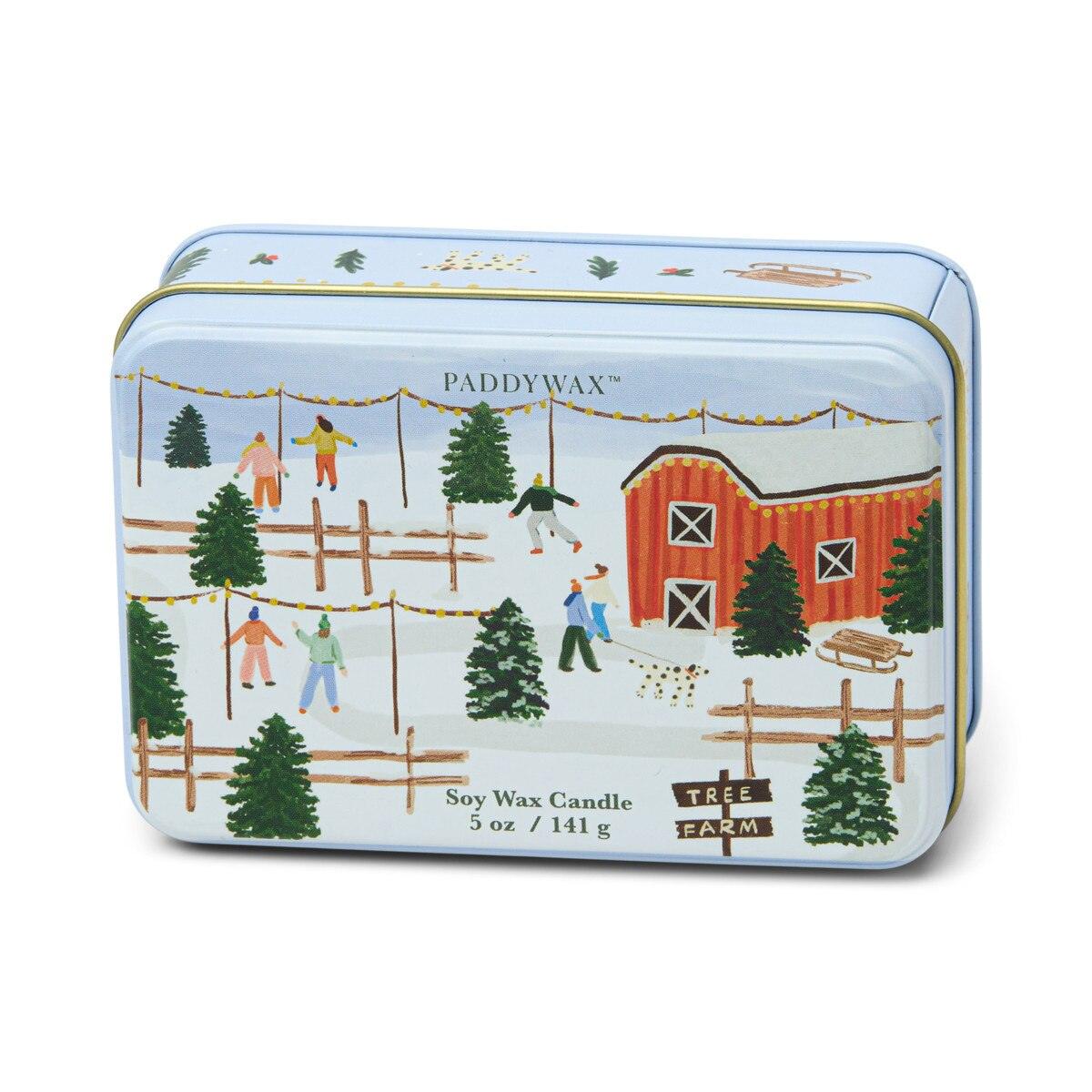 Paddywax Tree Farm Scene vanilla bean soy wax candle in closed matte blue tin with gold trim and winter illustration