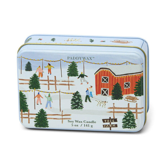 Paddywax Tree Farm Scene vanilla bean soy wax candle in closed matte blue tin with gold trim and winter illustration