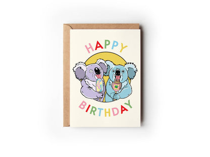 Lavender and blue koalas eating popsicles on yellow Happy Birthday card by Little Green Mini Creative