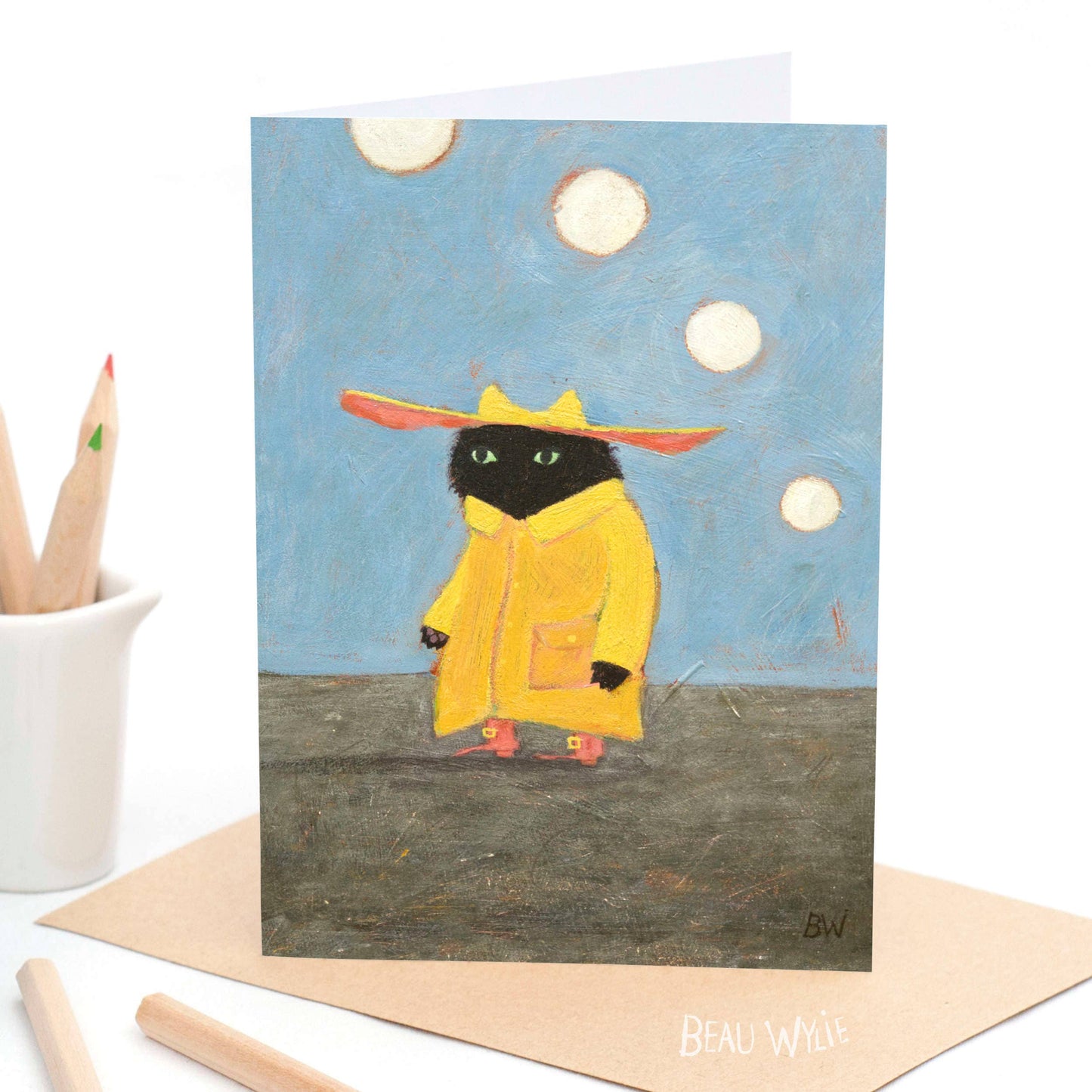Pascal greeting card by Beau Wylie featuring black cat in yellow raincoat on recycled cardstock from 9to5 Studios