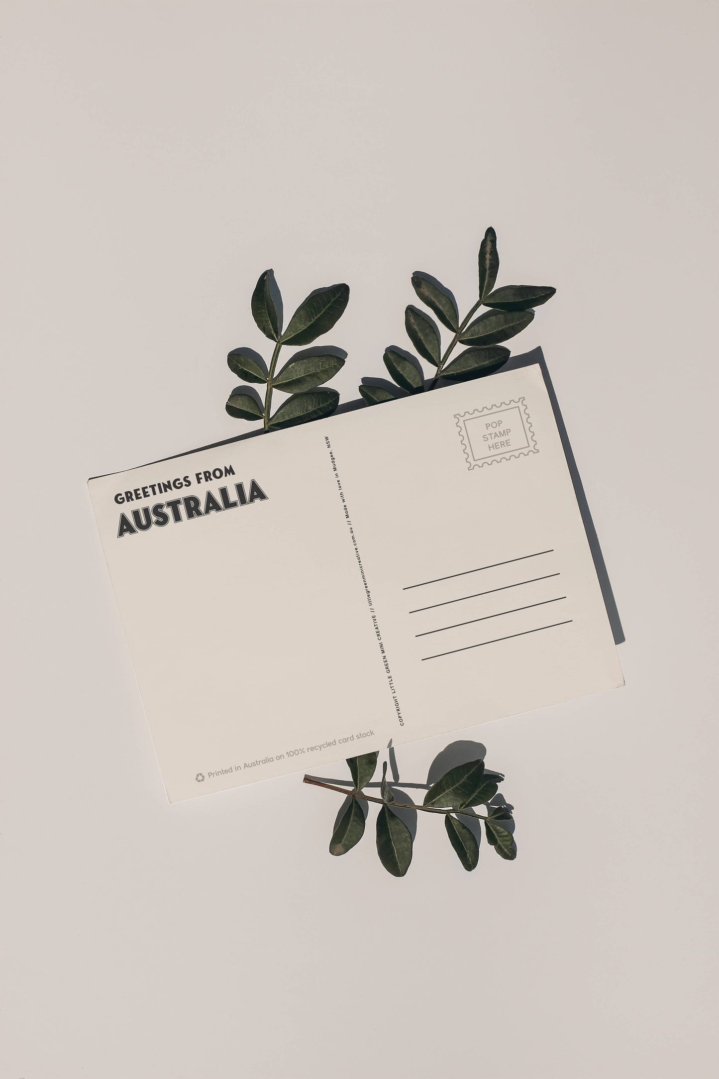 Back of 9to5 Studios Australia postcard displaying Greetings address lines and eco-friendly recycled cardstock details