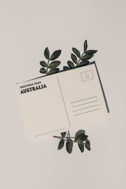 Back of 9to5 Studios Australia postcard displaying Greetings address lines and eco-friendly recycled cardstock details